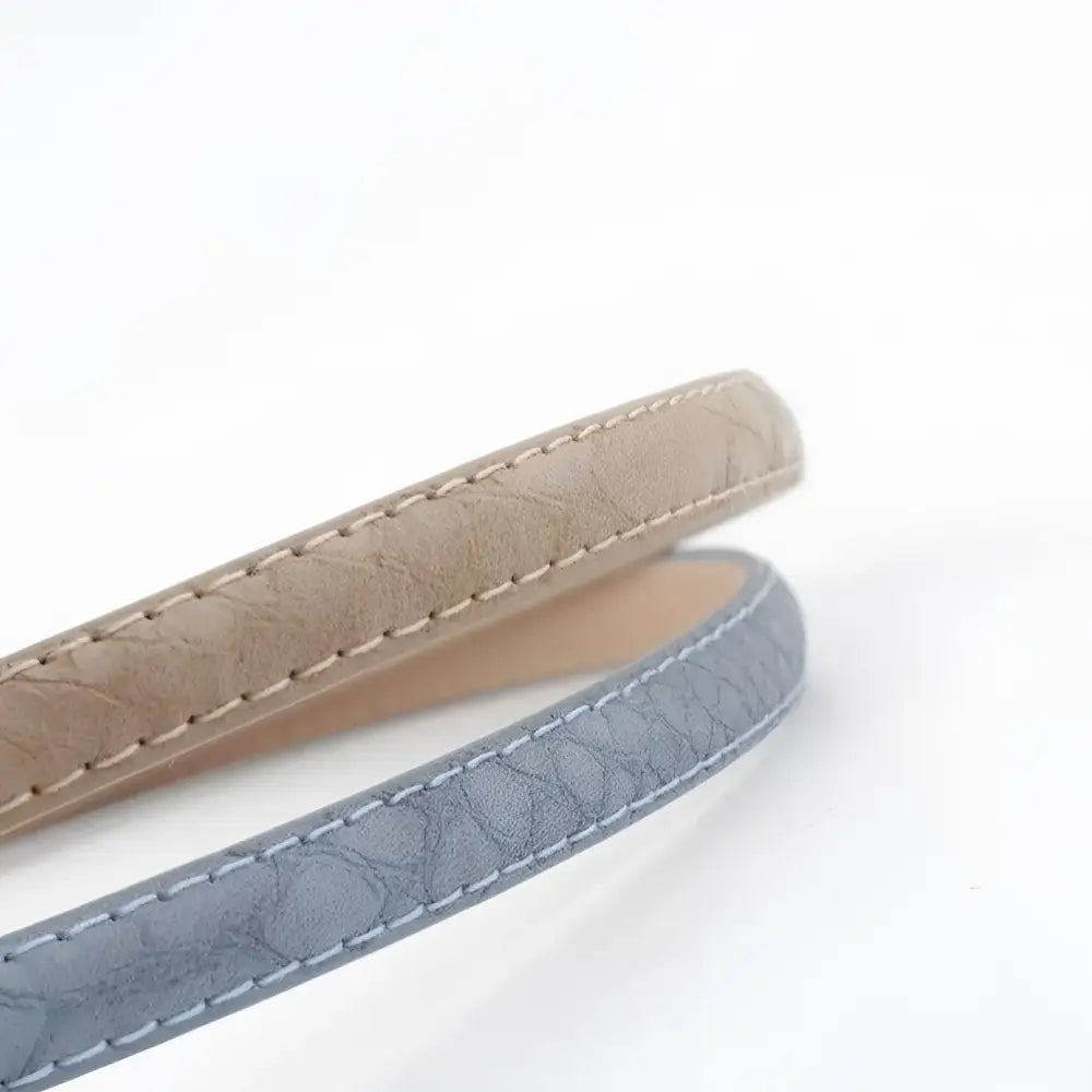 Agata belt featuring textured stitched straps with gold or silver buckles for stylish wear