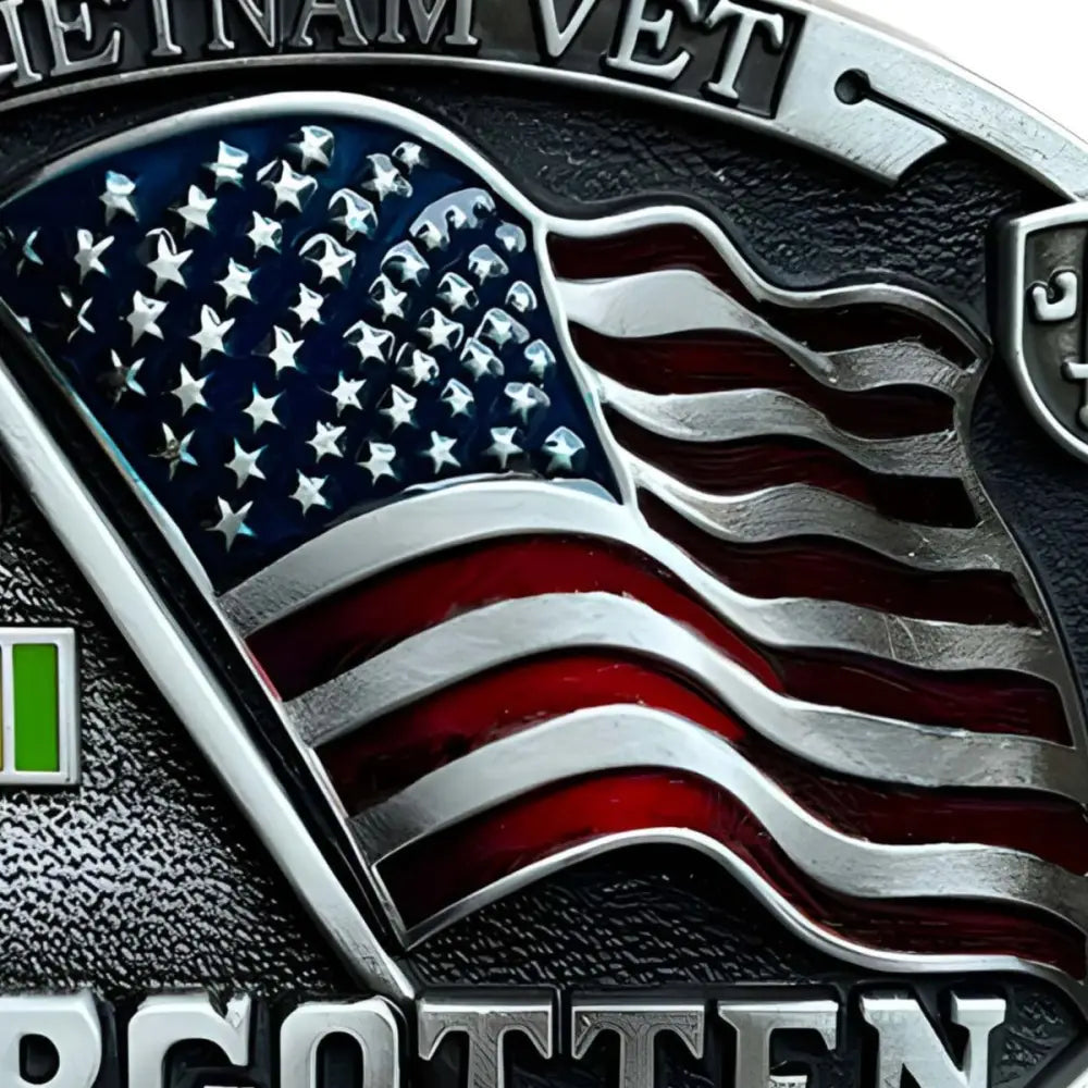 American flag emblem on belt buckle honoring forgotten heroes in service