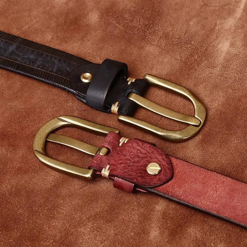 Assorted leather belts with brass buckles displayed for the product Assorted Leather Belts with Brass Buckles