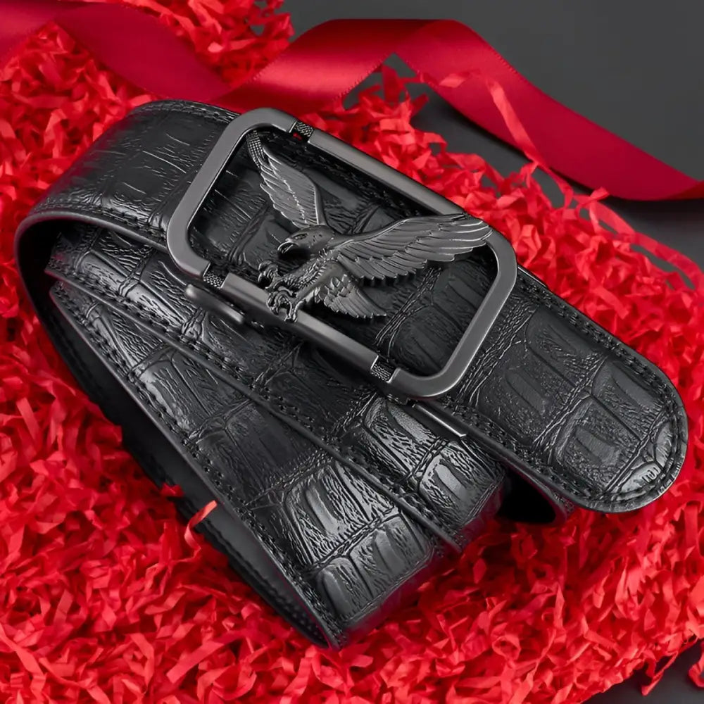 Black crocodile-patterned leather belt featuring an eagle buckle for a stylish appearance