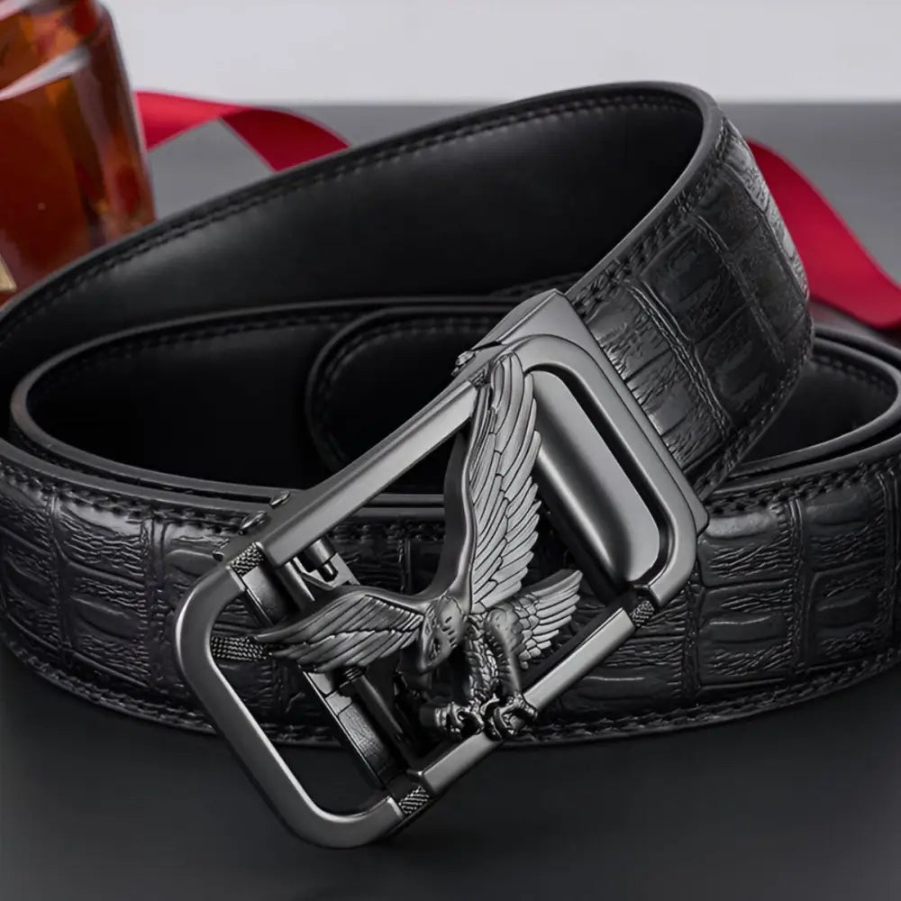 Black leather belt featuring an eagle-shaped buckle for a stylish and bold look