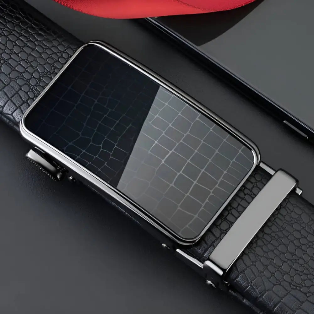 Black leather belt featuring a reflective patterned silver automatic buckle