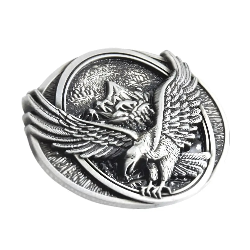 Silver eagle belt buckle prominently displayed in a collection of eagle-themed belt buckles