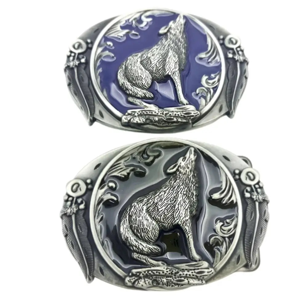Two wolf-themed oval belt buckles featuring a detailed howling wolf design