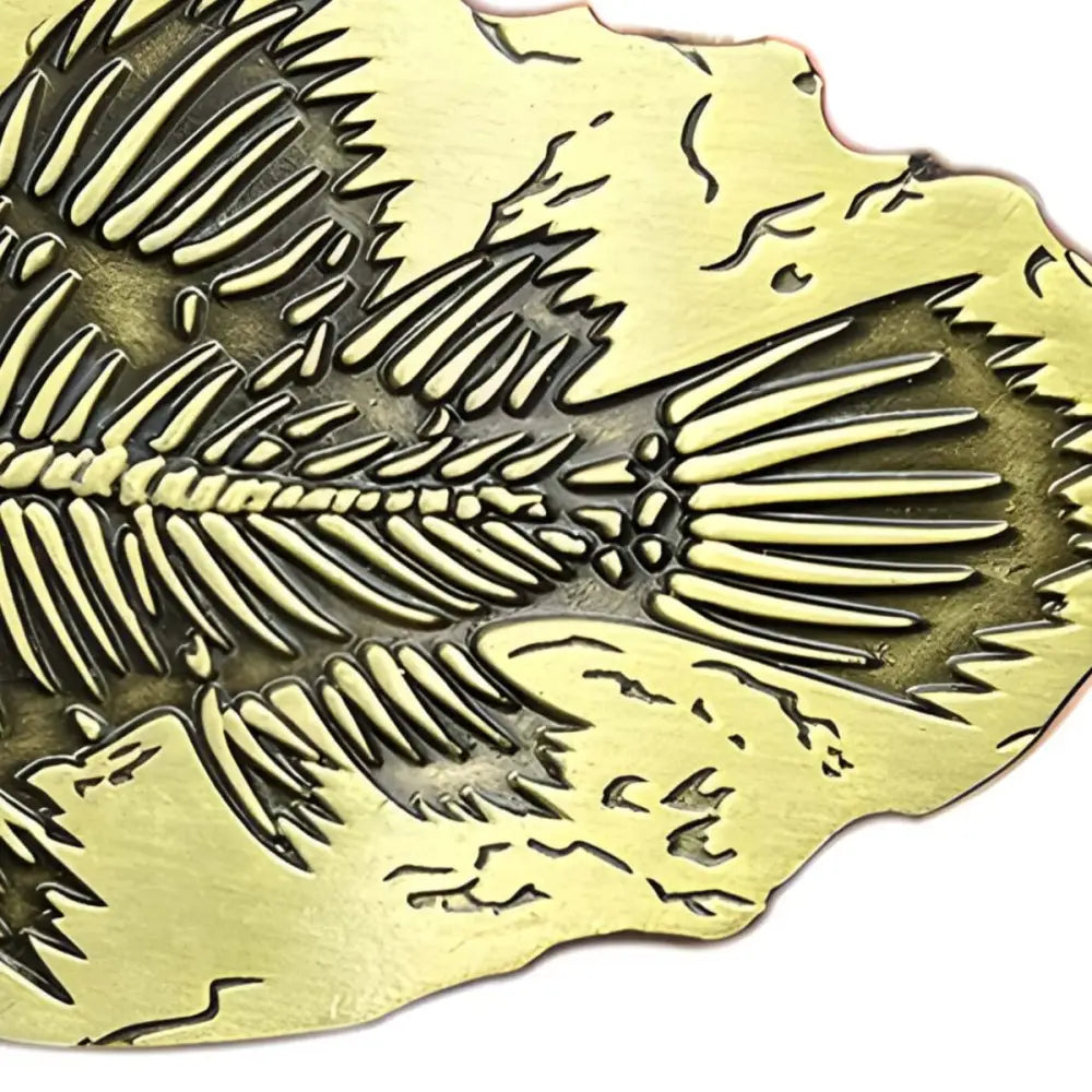 Embossed fish skeleton on metallic plate from Fossilized Fish Skeleton Replica in Matrix
