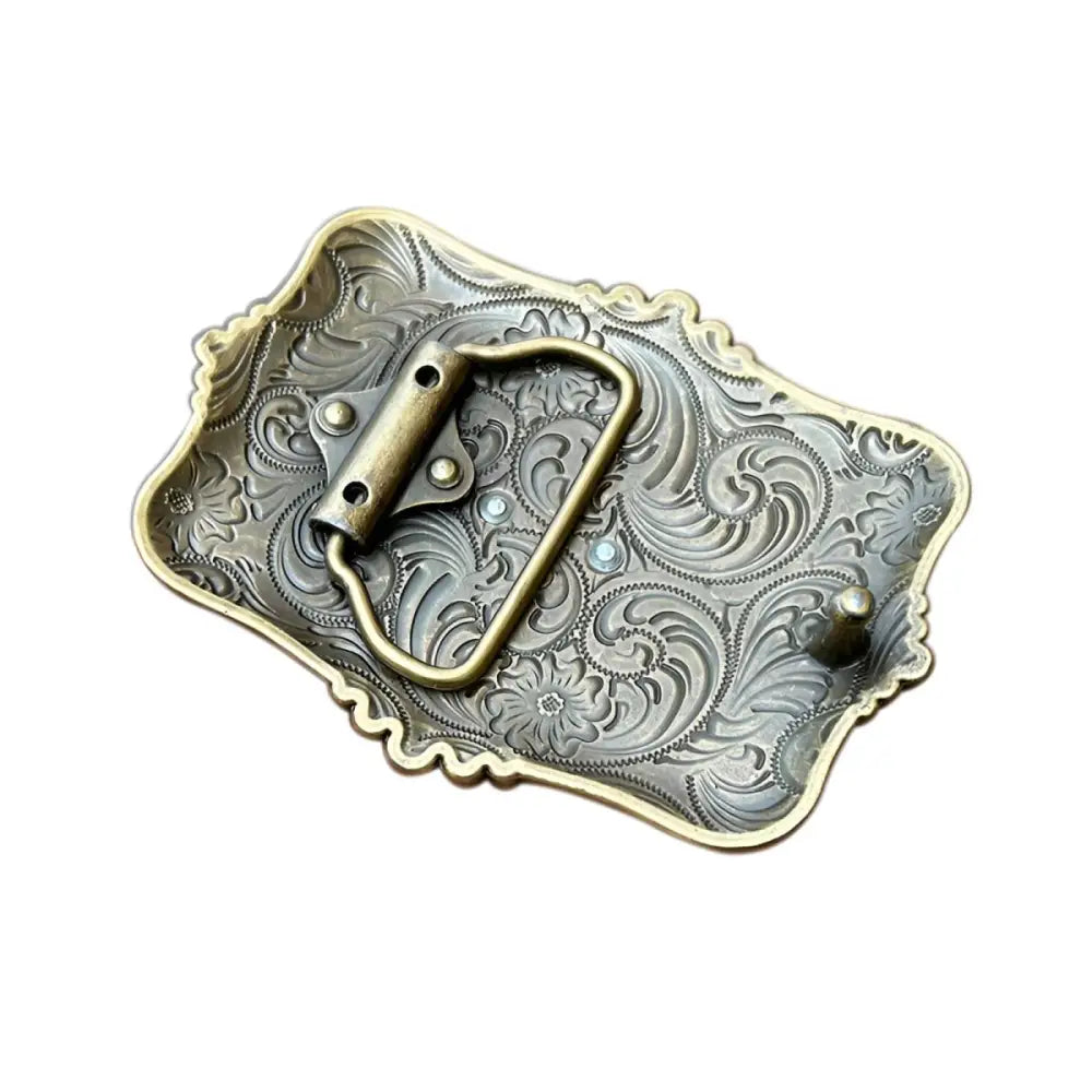 Ornate metal belt buckle with horse head design for elegant Western style footwear