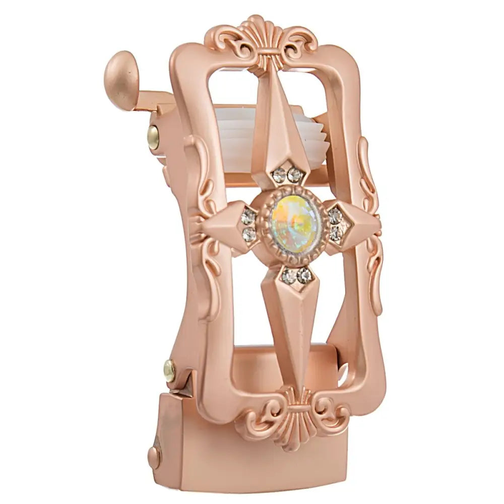 Ornate rose gold toilet paper holder from Belt Buckle and Accessory Collection