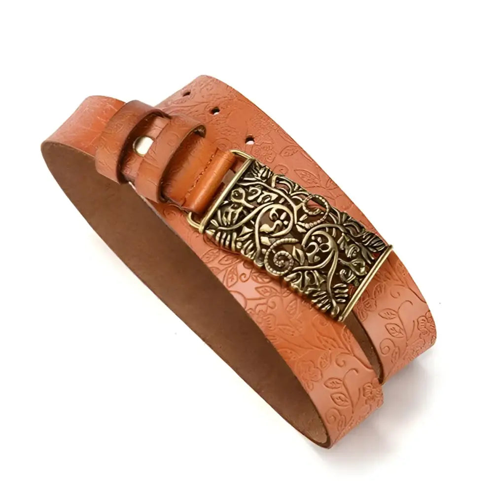 Embossed brown leather belt with ornate gold buckle for women