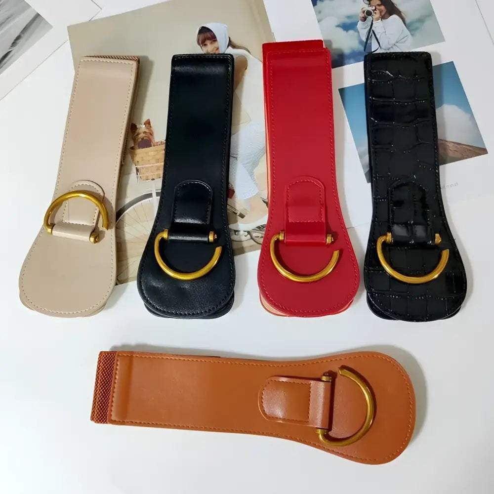 Assorted elastic waist belts with gold-tone buckles displayed with Brown Leather Belts and Teddy Bear Coat