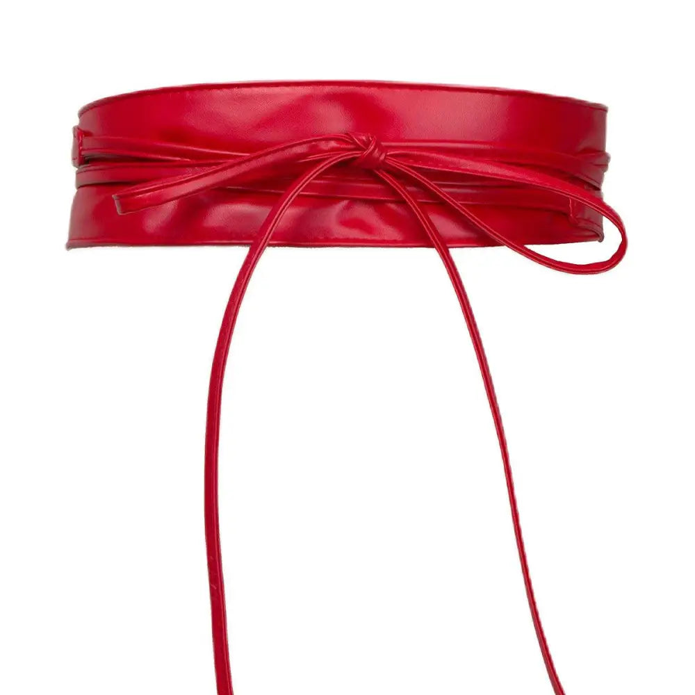 Red patent leather obi belt styled with Red Floral Dress featuring an Isabel Belt