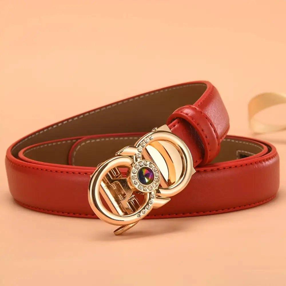Red leather belt with a jeweled gold buckle suitable for formal and casual wear