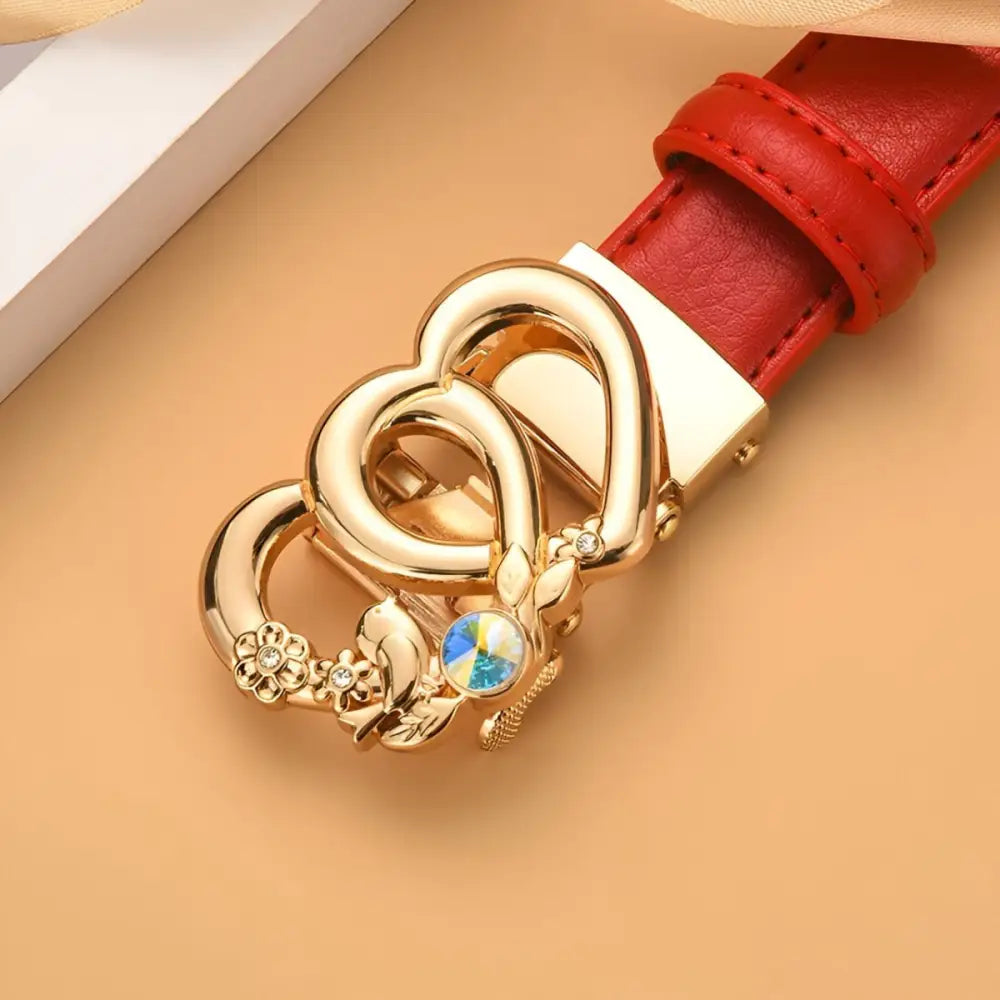 Red automatic leather belt with gold heart-shaped buckle for stylish elegance