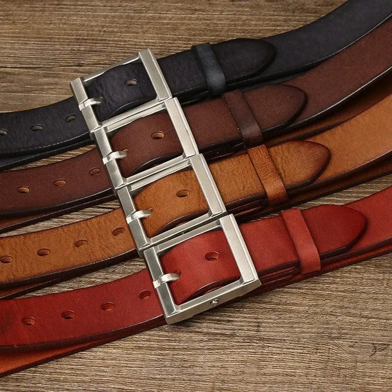 Assorted leather belts with brass buckles displayed’s professional and stylish collection