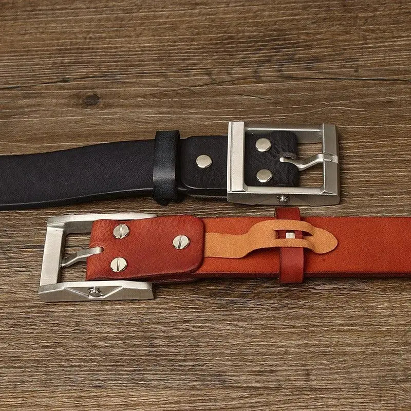 Assorted leather belts with brass buckles displayed for sale