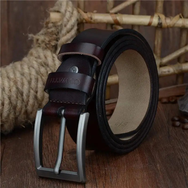 Rolled brown leather belt with silver buckle displayed alongside Blue Camouflage Sweater for Men