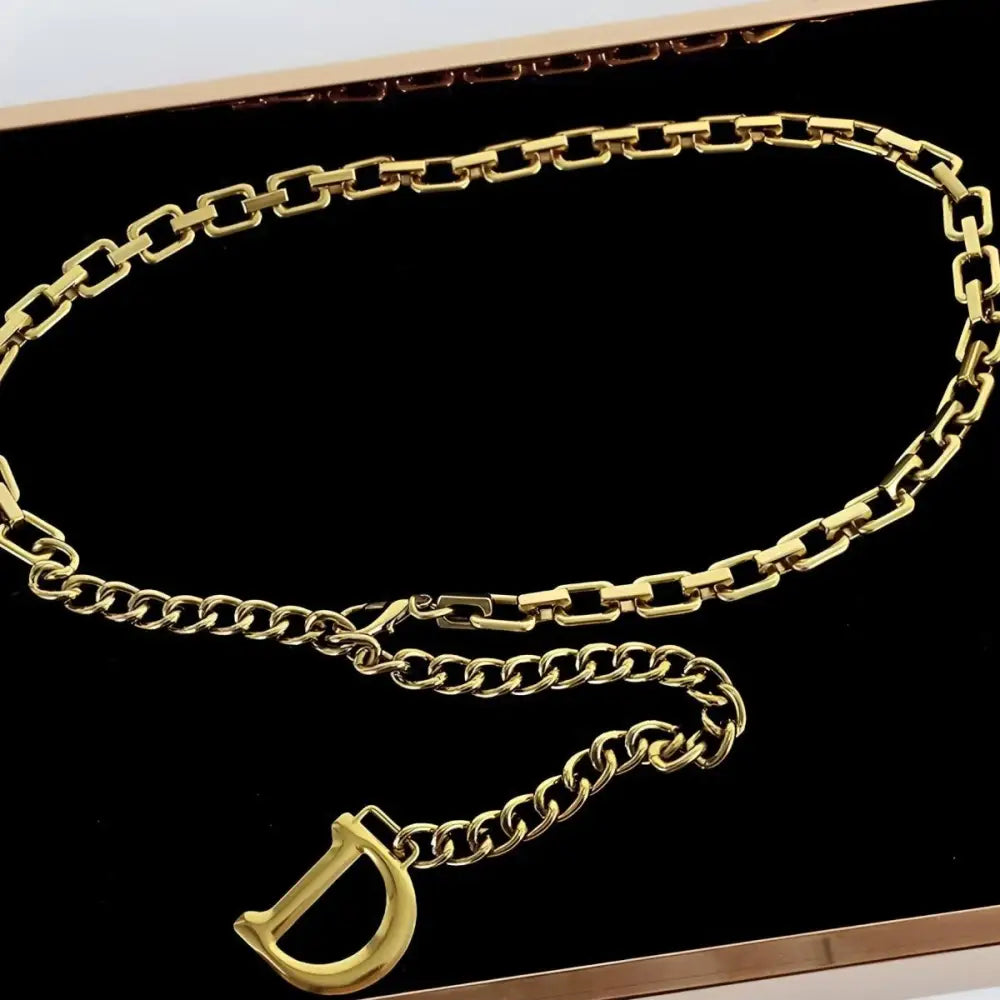 Gold-toned chain belt with D charm from Anasenko Chain Belt collection for stylish black outfits