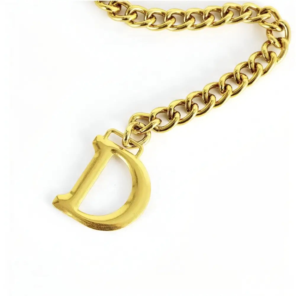 Gold-toned chain belt featuring a D charm on Anasenko chain belt for stylish outfits