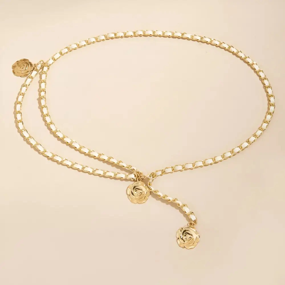 Gold chain belt with rose-shaped charms designed for black dresses