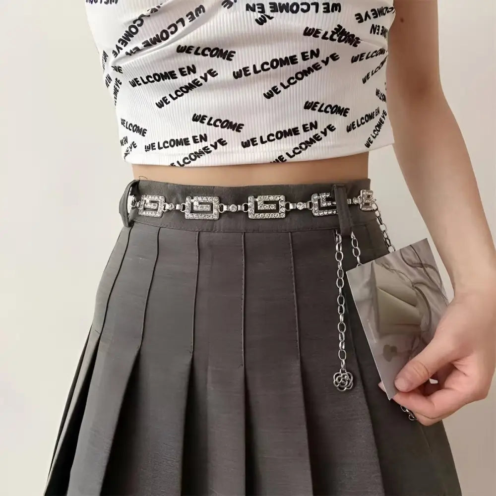 Gray pleated skirt with dudina women’s chain jeweled belt featuring geometric and floral accents