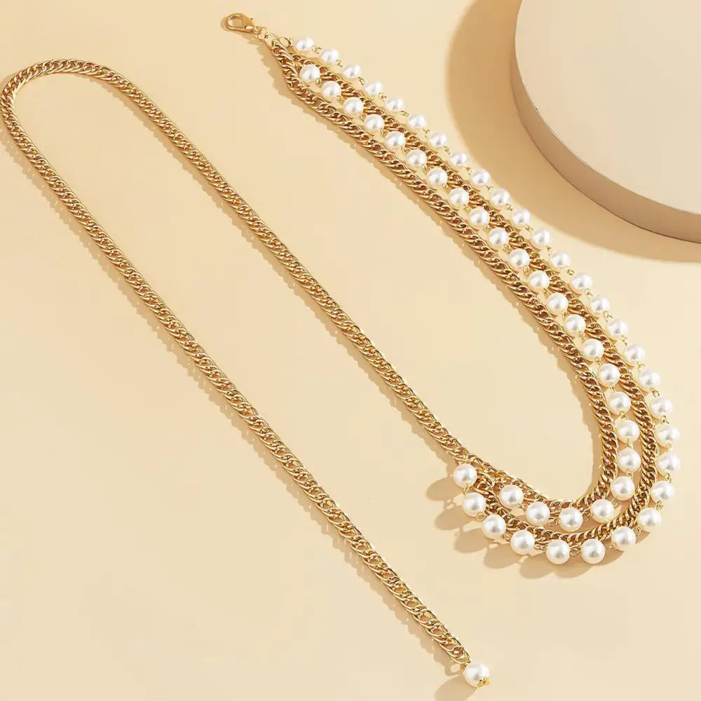 Gold chain belt with pearl accents featuring an Iomache chain design for elegant style