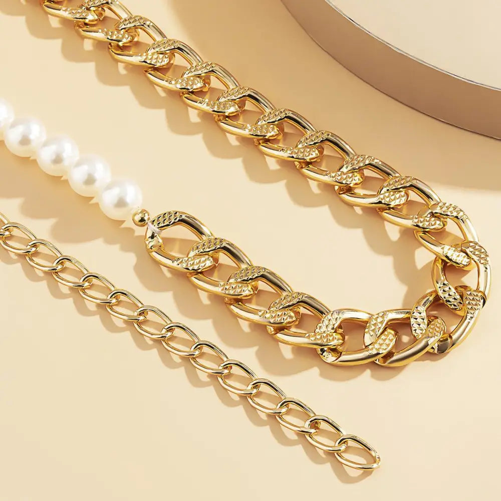 Gold-tone chain and pearl necklace paired with Silver Chain Belt Necklace for elegant style