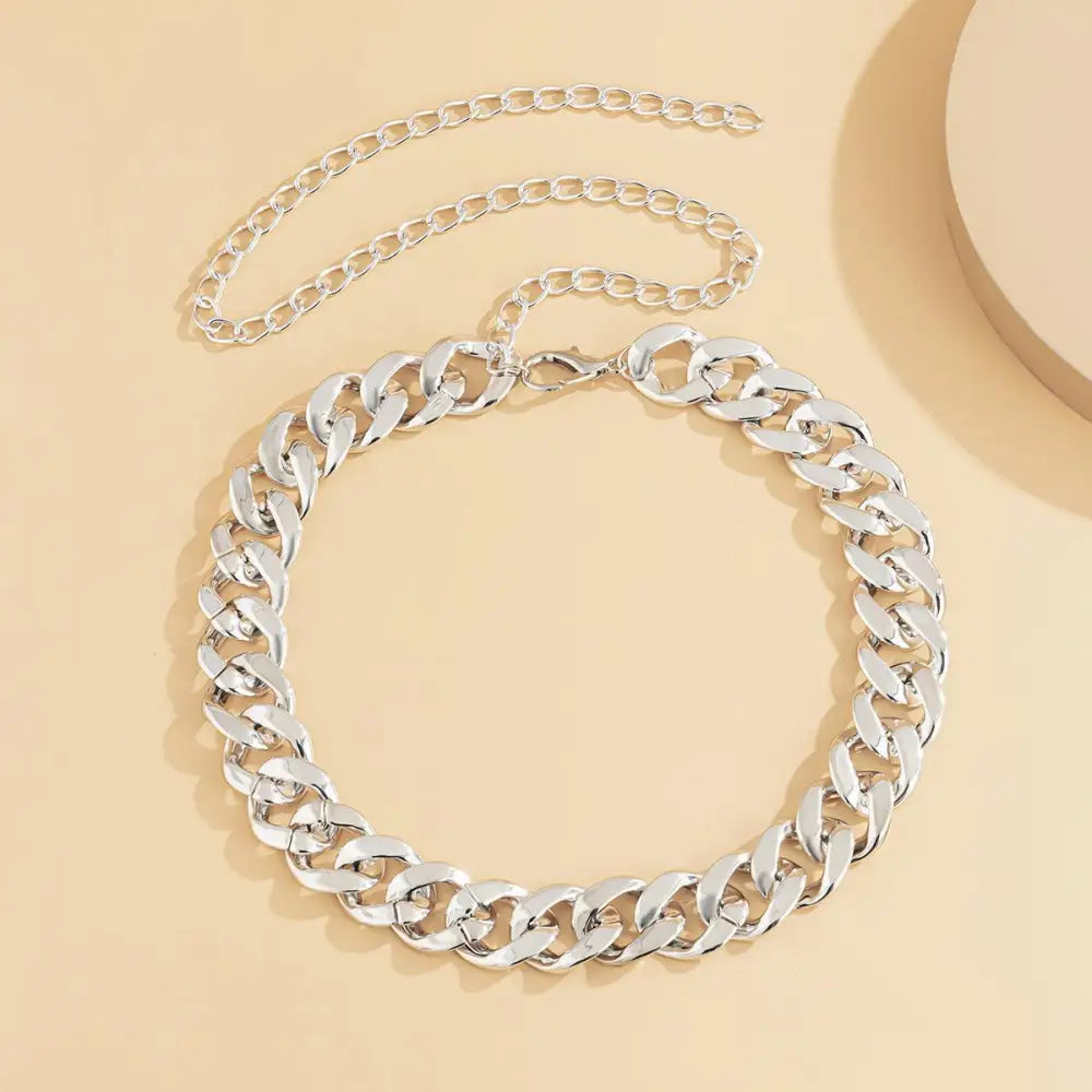 Silver chain link necklace displayed on Silver-Toned Gold Chain Belt for Stylish Everyday Wear