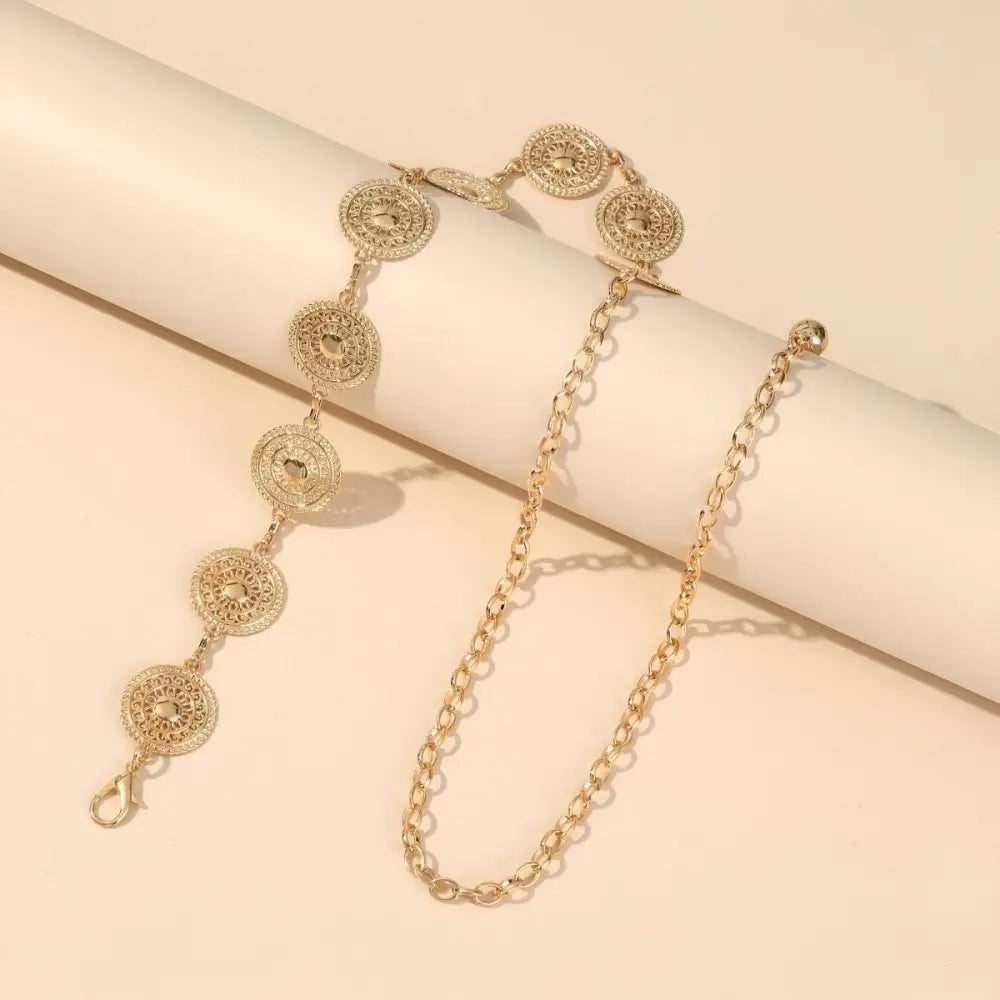 Gold-toned filigree medallion belt enhancing the aesthetic appeal of the Oria Chain Belt