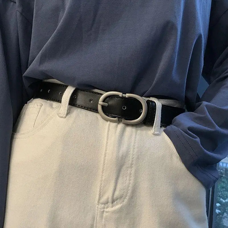 Black leather jaelynn belt featuring a silver double-circle buckle accessory