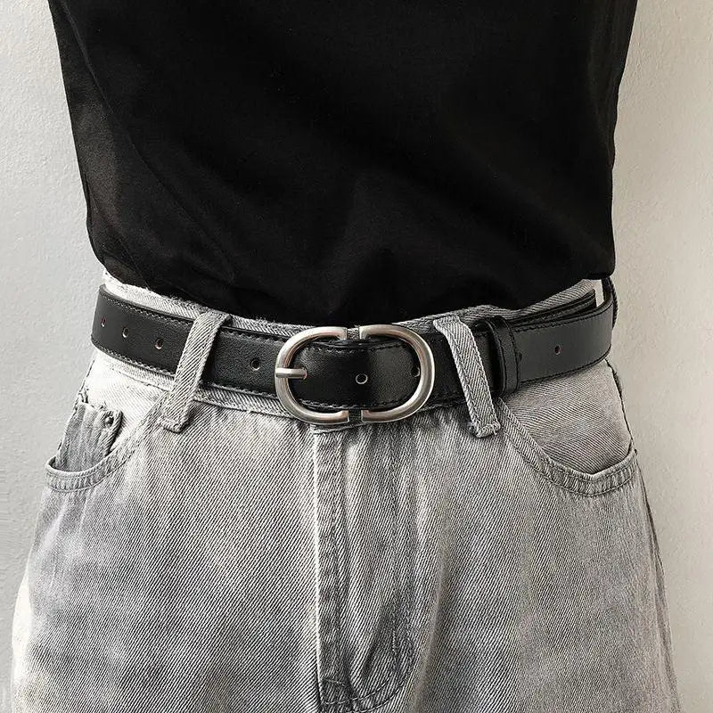 Black leather jaelynn belt featuring a silver double-oval buckle for elegant style