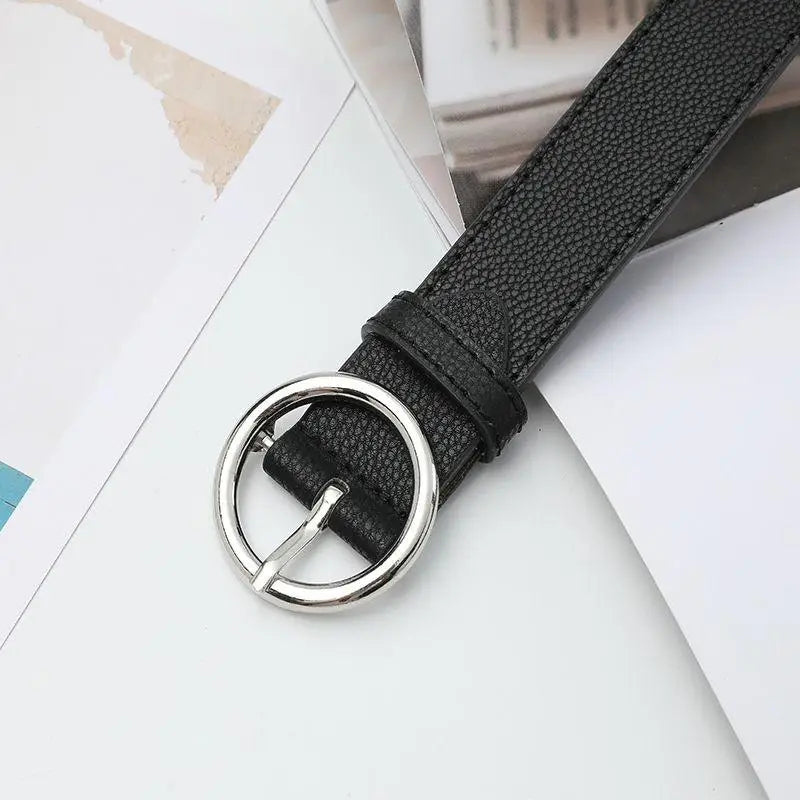 Black leather Murielle Belt with circular silver buckle for stylish accessories