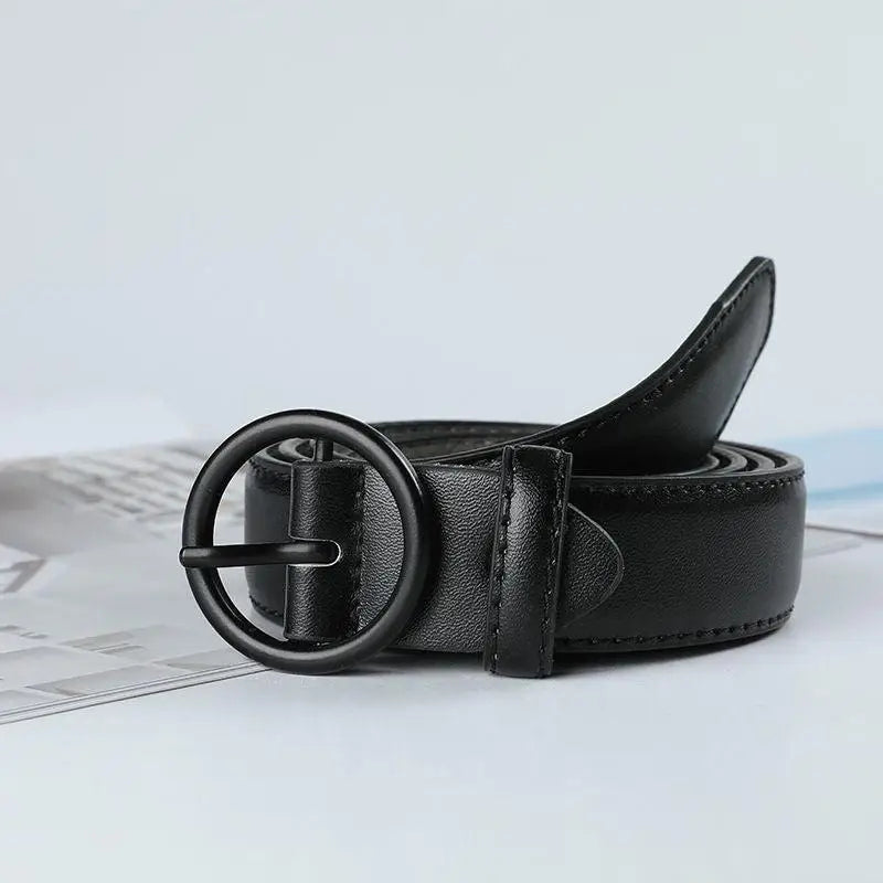 Black leather belt with round buckle displayed in product named Black Leather Belt with Round Buckle