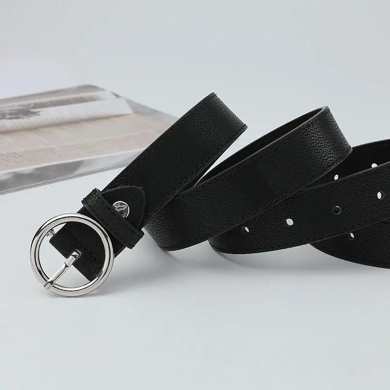 Black leather murielle belt with silver circular buckle for stylish accessories