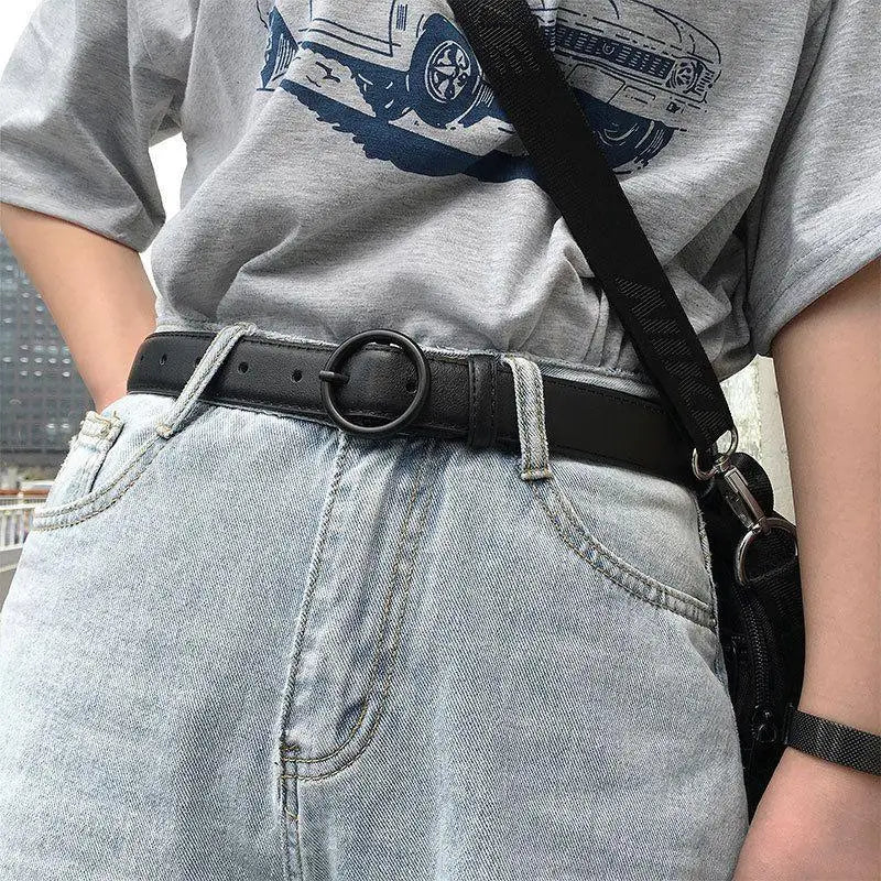 Black Leather Belt with Round Buckle showing a sleek black belt with circular buckle for elegant style