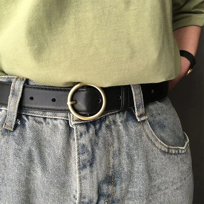 Black leather belt featuring a gold round buckle for a sophisticated look