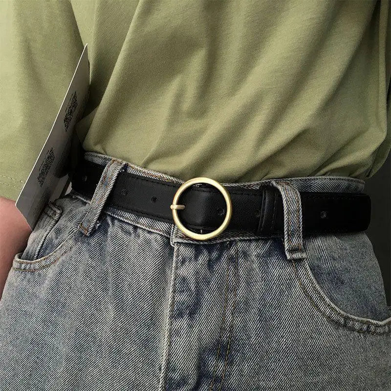 Black leather belt featuring a gold circular buckle for a sophisticated look