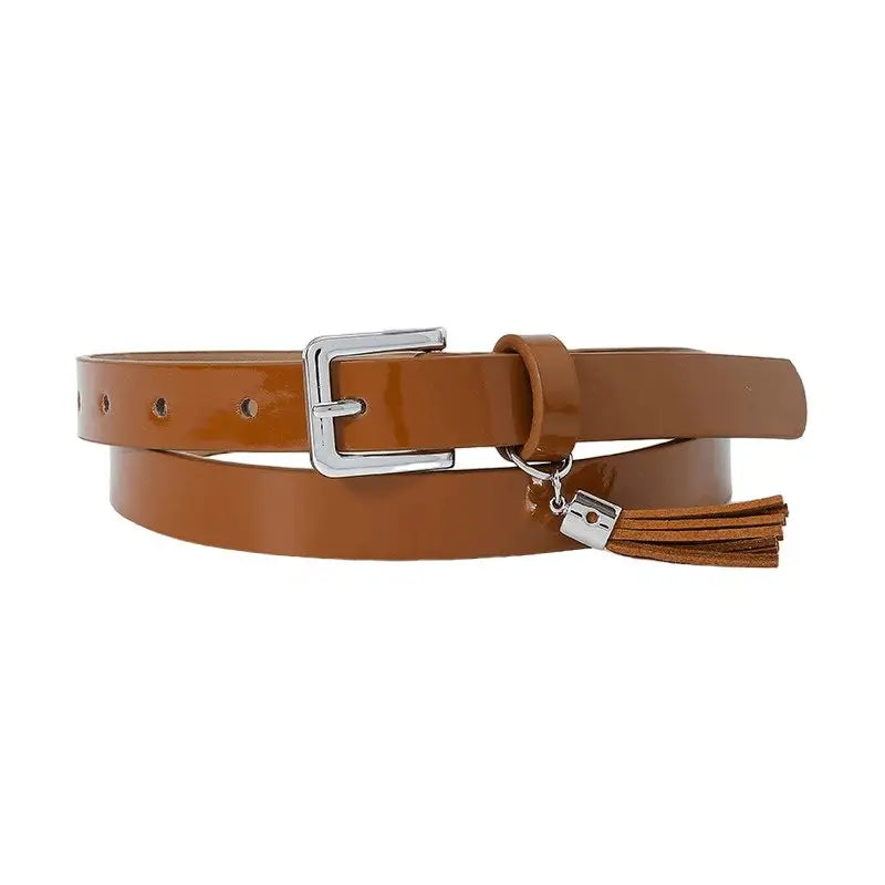 Brown patent leather women’s belt with silver buckle and tassel for stylish accessories