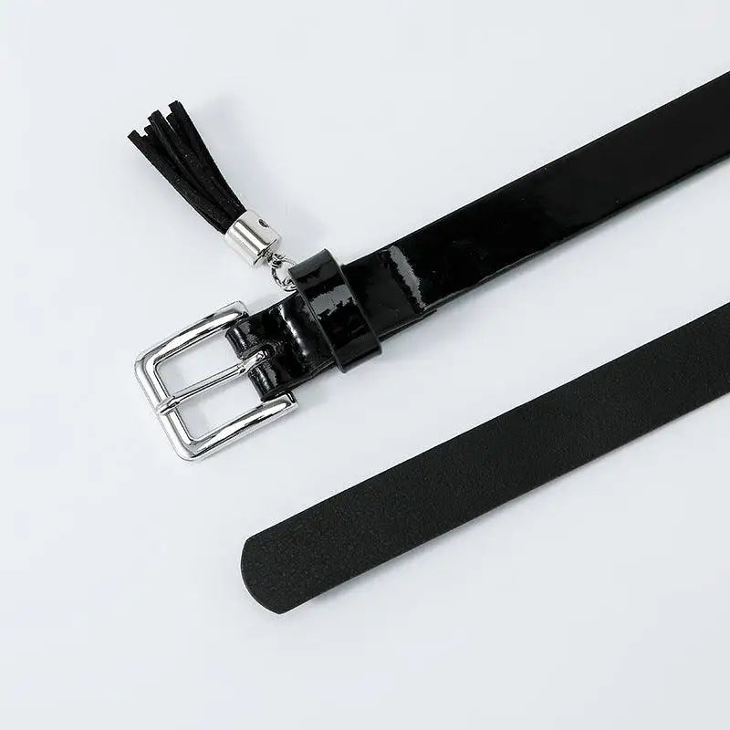 Black patent leather women’s belt with tassel and silver buckle for stylish accessories