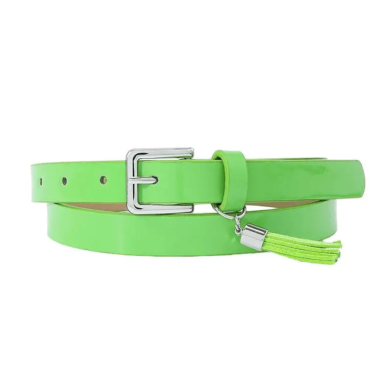 Green patent leather women’s belt with tassels and silver buckle for stylish accessories