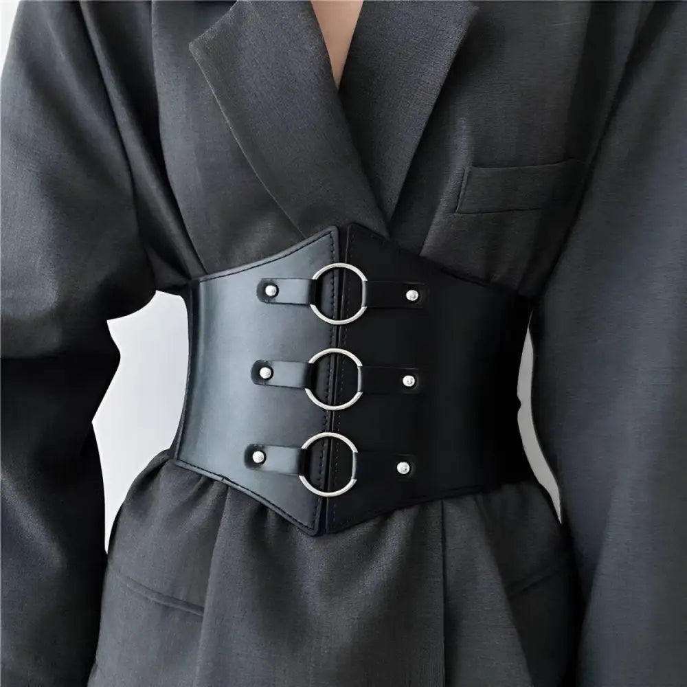 Black leather corset belt with metal rings for stylish waist enhancement