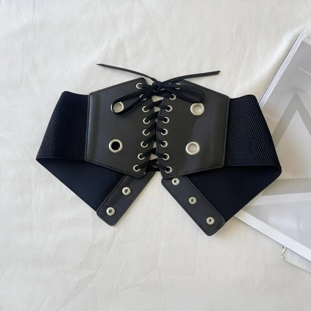 Black corset belt with silver grommets for stylish waist accents