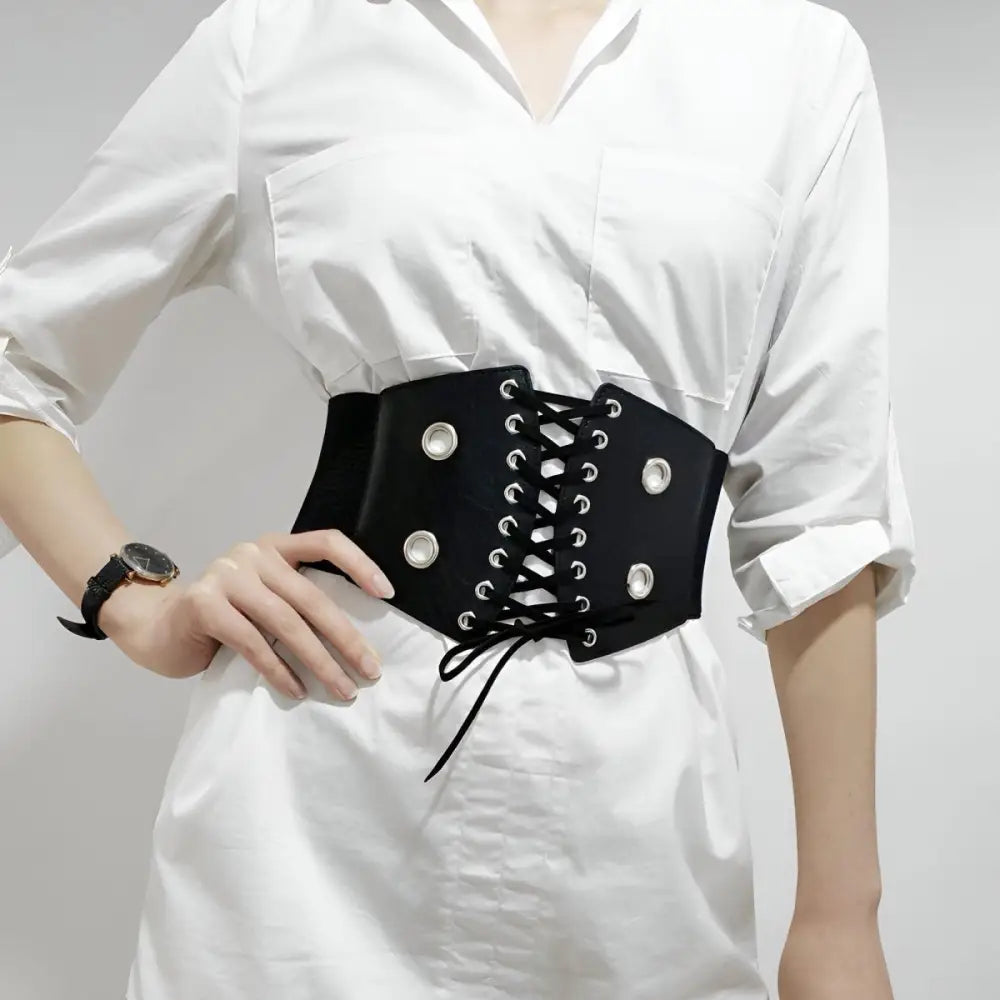 Black corset belt with silver grommets for stylish waist accents
