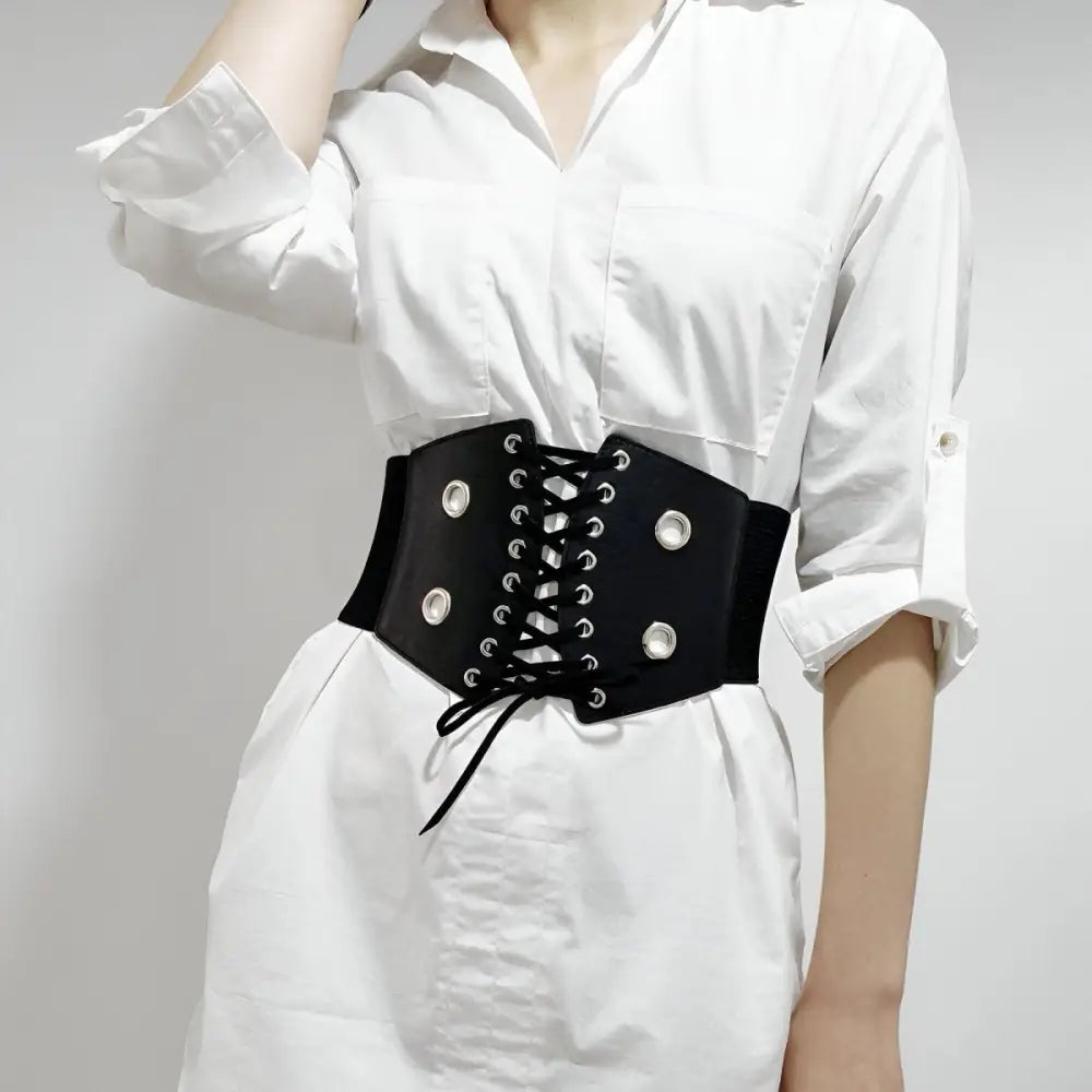 Black corset belt with silver grommets for stylish waist accentuation