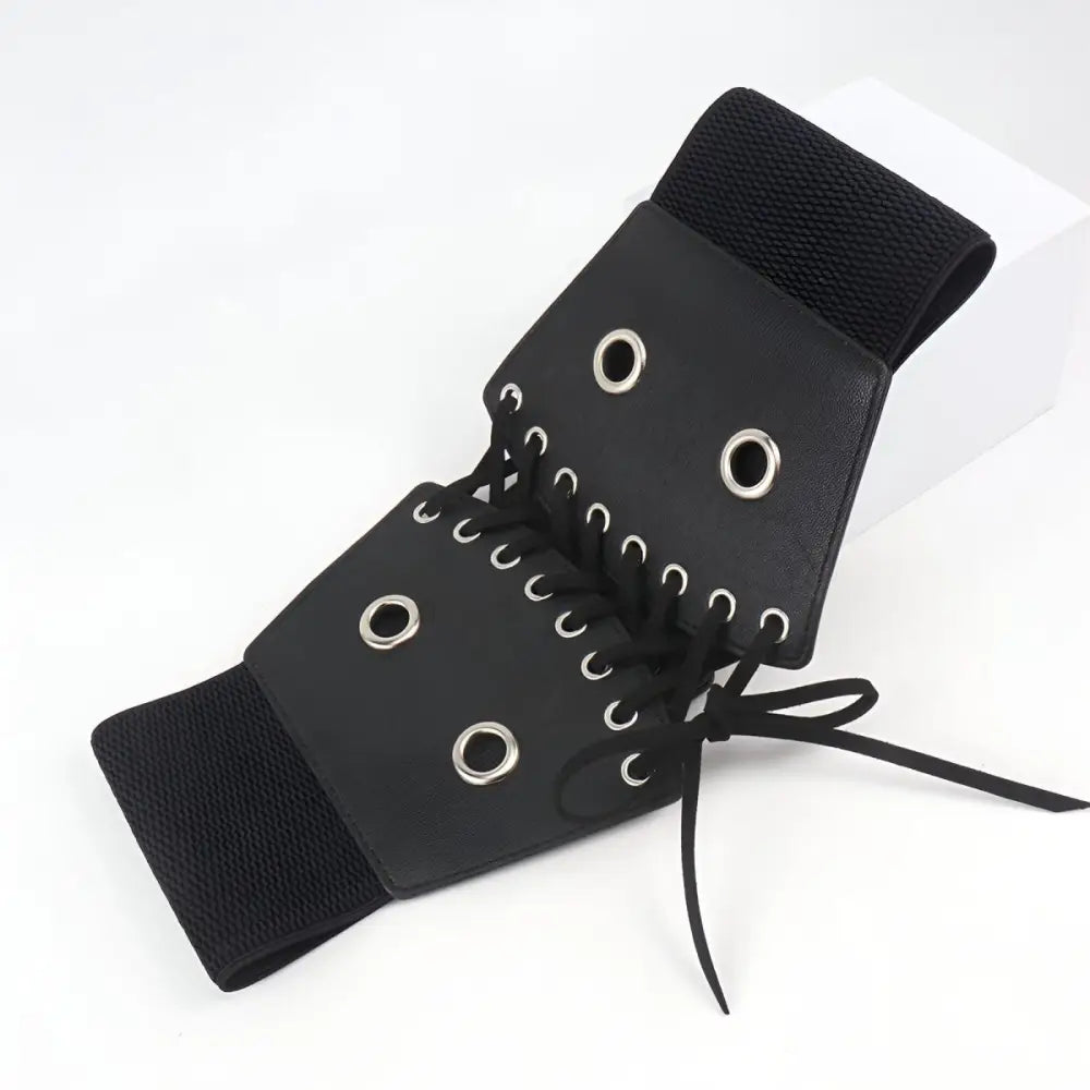 Black corset belt with silver grommets for stylish waist accentuation