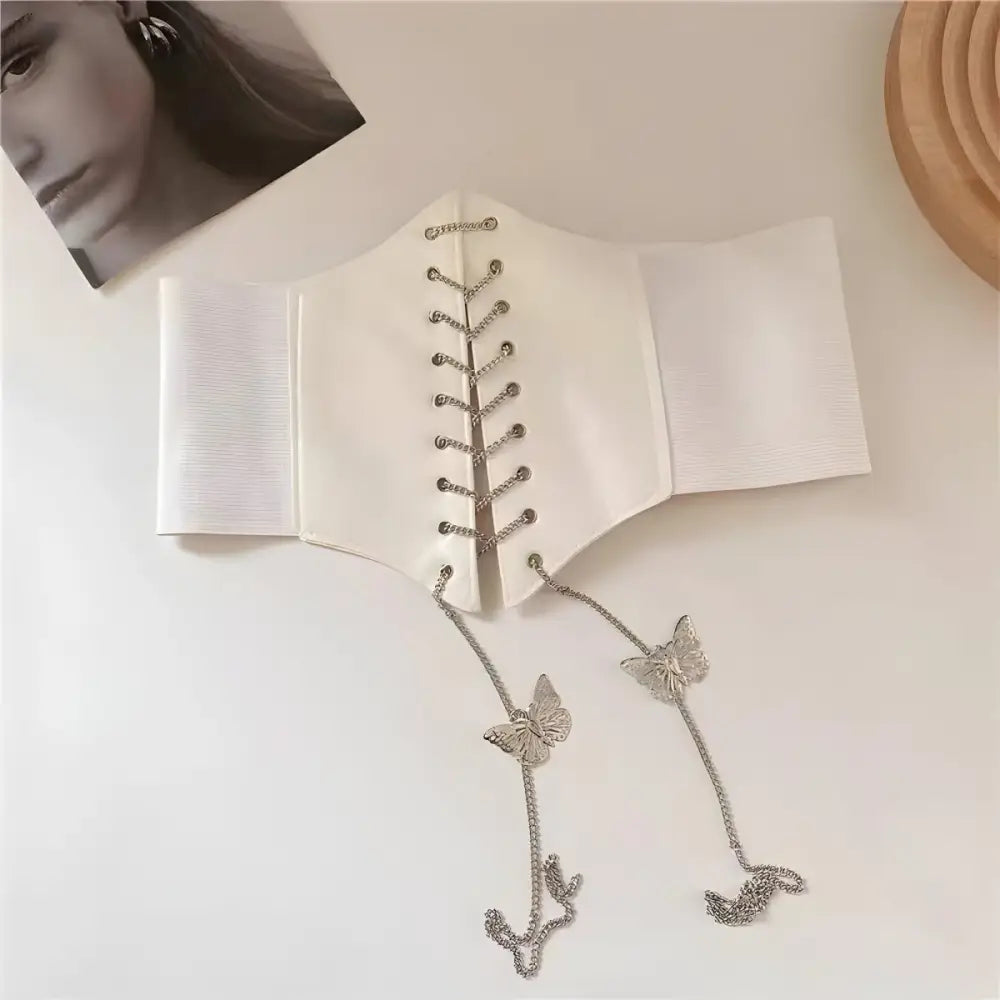 White corset belt with butterfly chain details for stylish fashion accessories