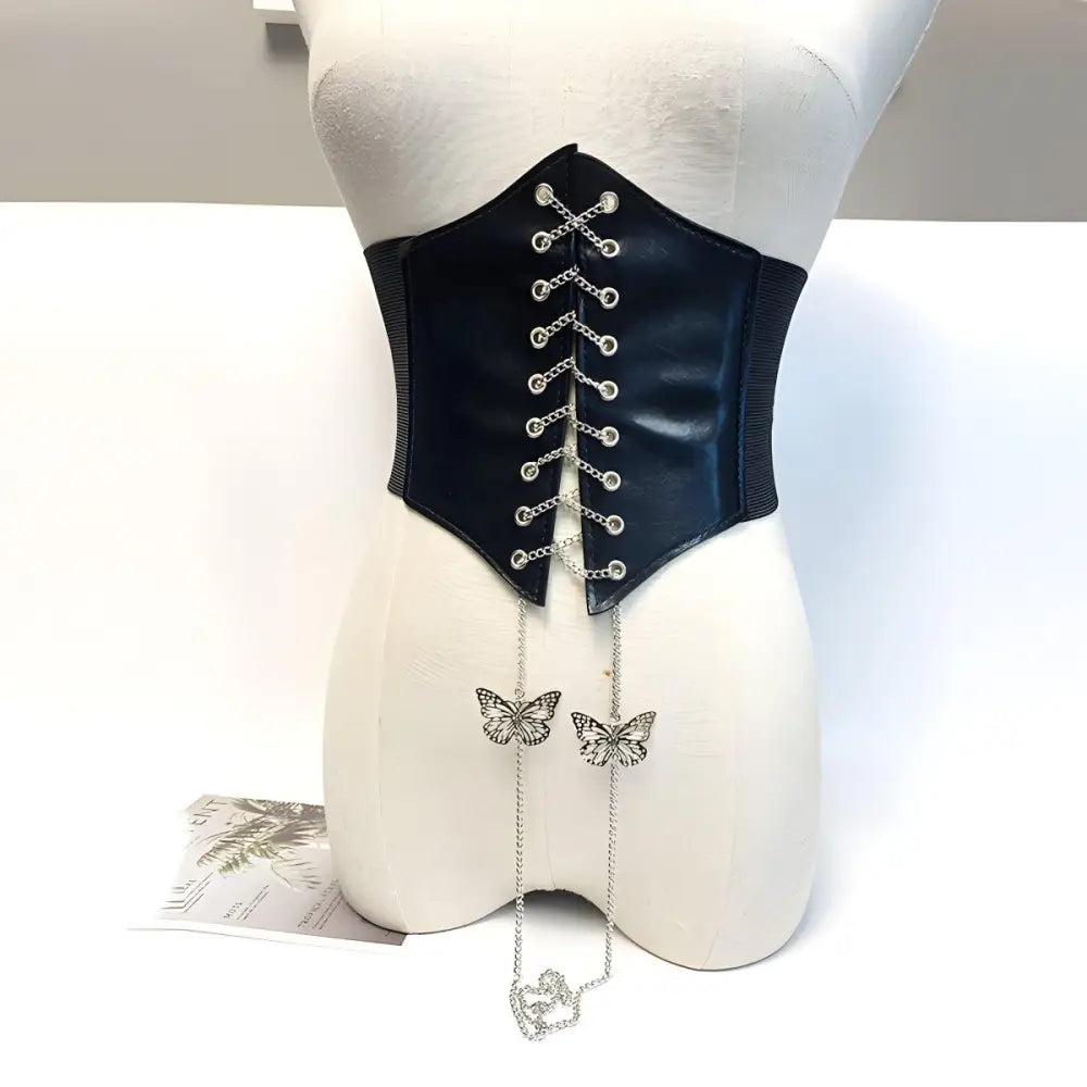 Elegant corset belt with butterfly chain accents and silver details for stylish wear
