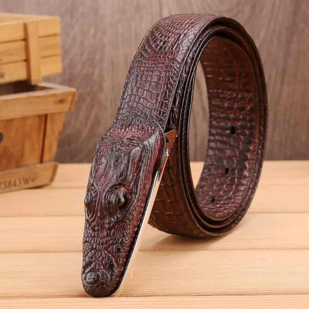 Enokur men’s belt featuring a crocodile leather strap and a crocodile head buckle