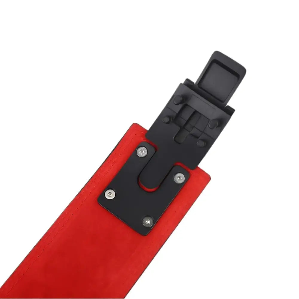 Red and black ski binding component on leather powerlifting belt with Victor model buckle