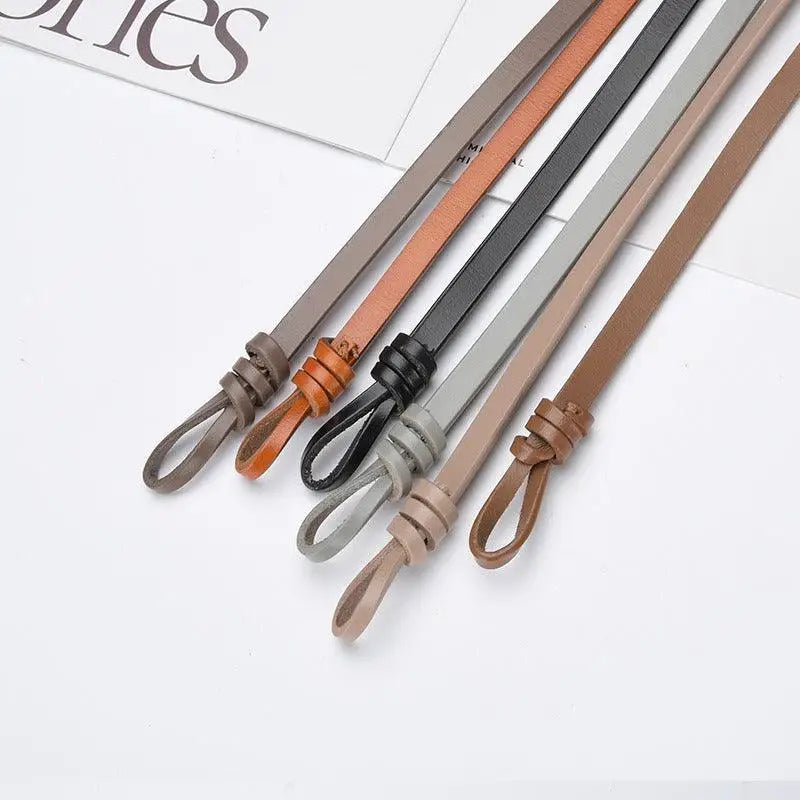 Assorted leather tie belts and slim leather belt showcasing aesthetic appeal and quality leather