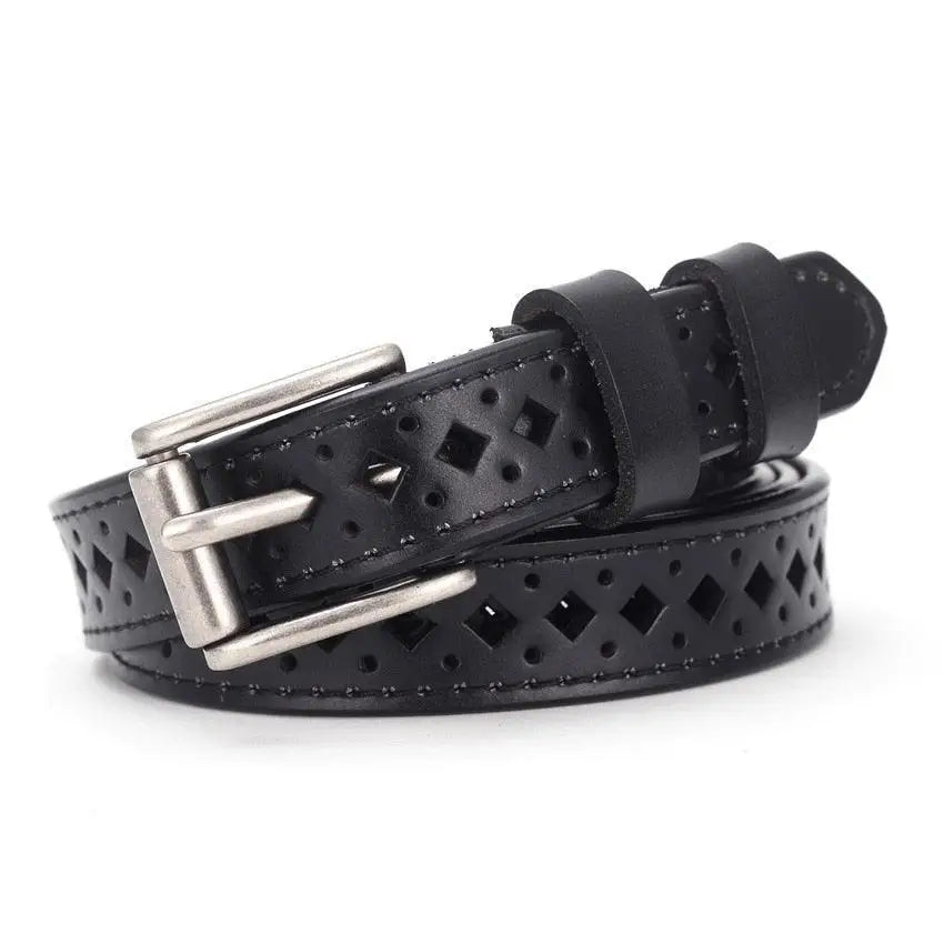 Black leather belt with diamond cutouts paired with distressed denim shorts