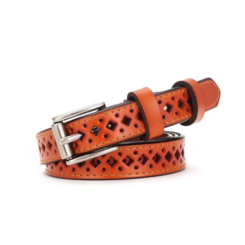 Orange leather belt with diamond cutouts paired with Distressed Denim Shorts